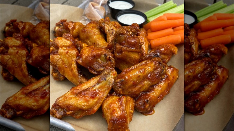 chicken wings with carrots, celery, and sauce