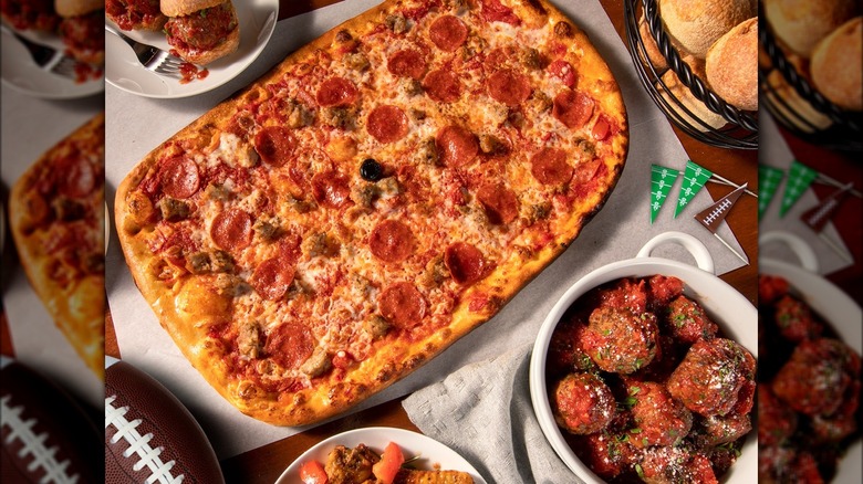 Bertucci's pizza and sides with football