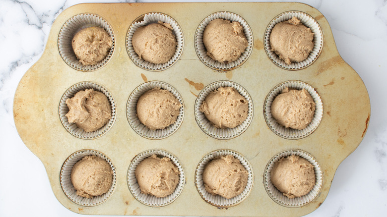 muffin tins with batter