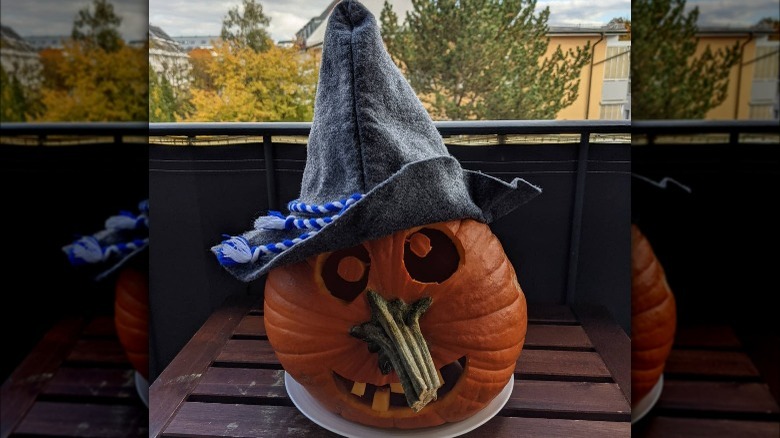 A pumpkin carved to look like a witch