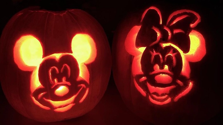 Two pumpkins with Mickey and Minnie's faces