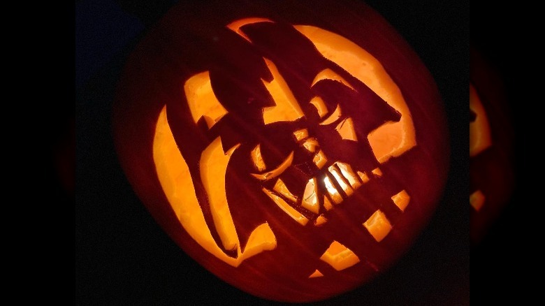 A pumpkin with Darth Vader carved on it