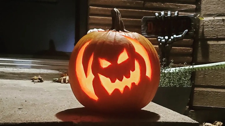 A pumpkin carved with the shape of Oogie Boogie