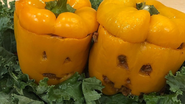 Two peppers with jack-o-lantern faces