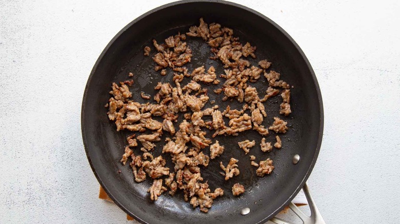 crumbled sausage in a skillet