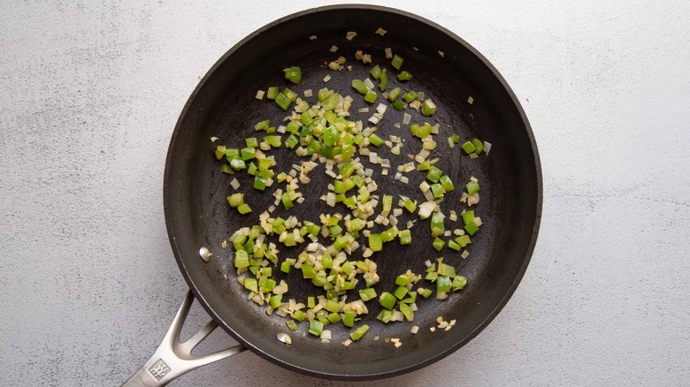 cooked onion and pepper in a skillet