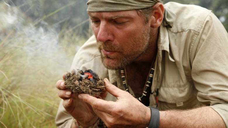 Les Stroud starting a fire