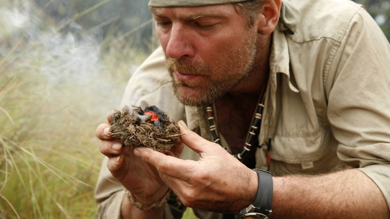 Les Stroud starting a fire