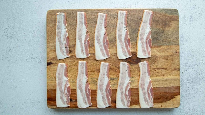 bacon strips on wooden board