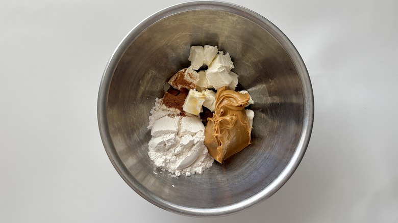 peanut butter sugar and butter in a metal bowl