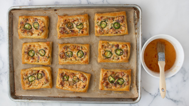 baked cheese and jalapeño tarts with pepper jelly