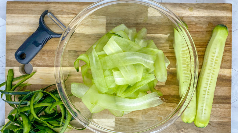 sliced cucumbers on board