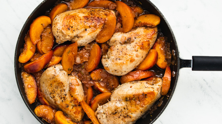 chicken breast nestled in peach sauce