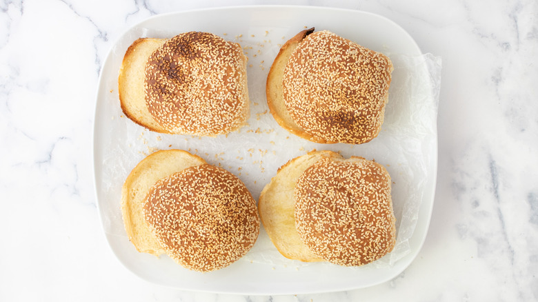 four toasted burger buns