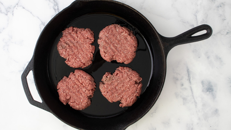 beef patties in skillet