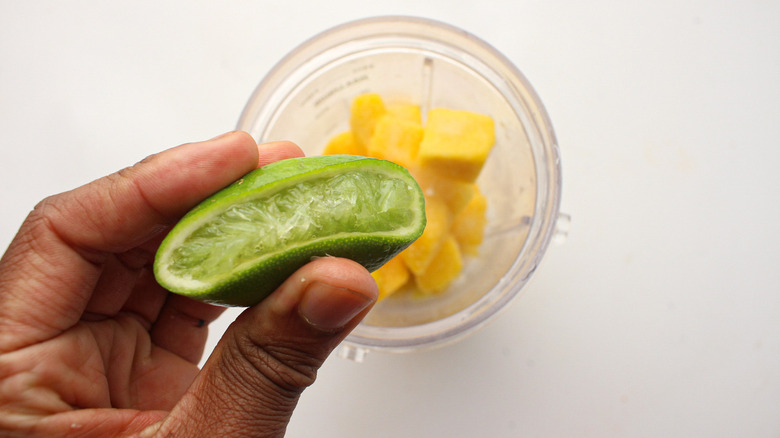 squeezing lime into blender