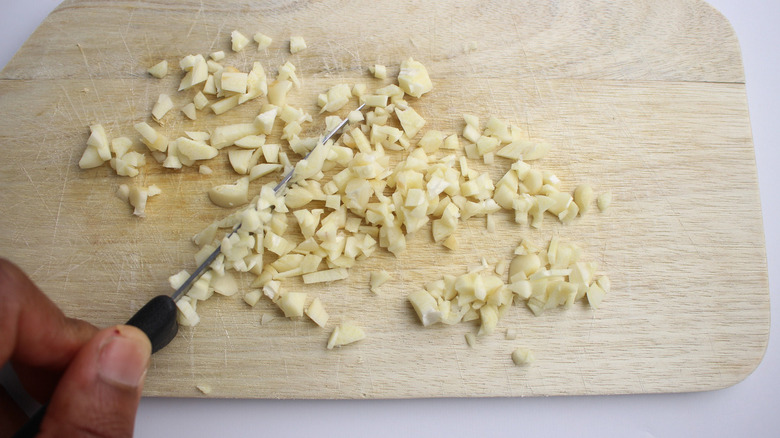 minced garlic on cutting board