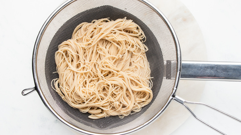 Noodles draining in strainer