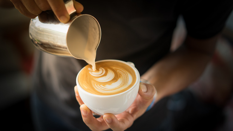 pouring milk to make latte art