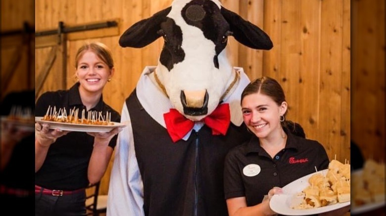 Chick-Fil-A caterers with cow mascot