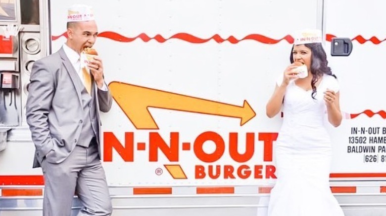 bride and groom eating In-N-Out burgers