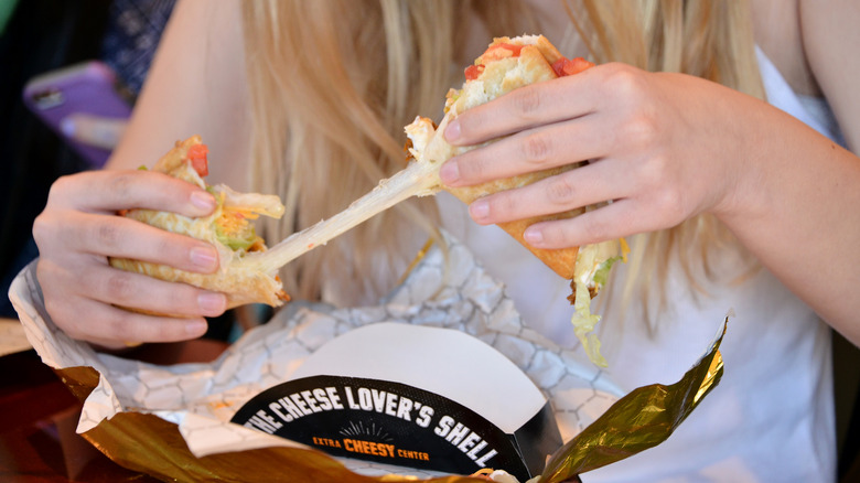 Person pulling apart a Quesalupa shell