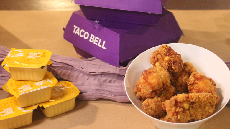 Chicken nuggets with purple Taco Bell boxes