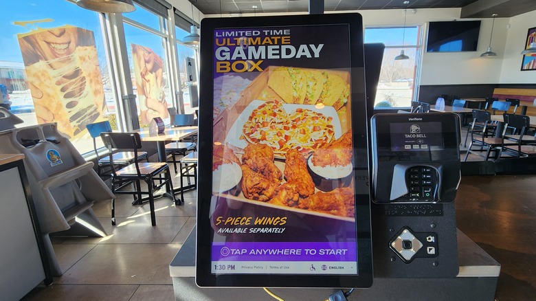 Taco Bell kiosk with Ultimate Gameday Box adveratisement