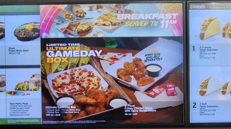 Taco Bell indoor menu board featuring the Ultimate Game Day Box