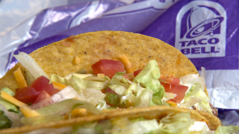 Closeup of a crunchy taco in Taco Bell wrapping paper