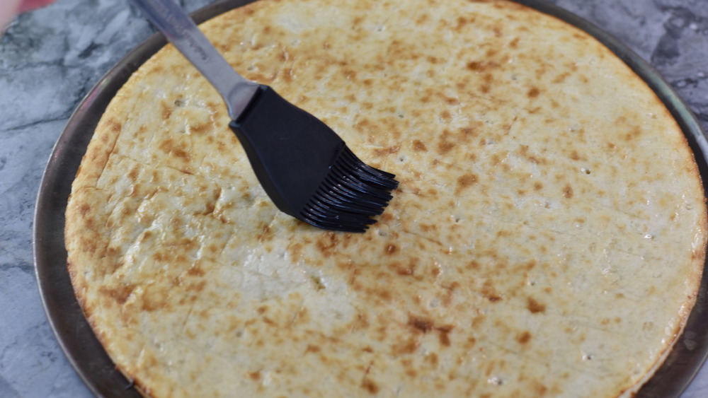 preparing pizza crust