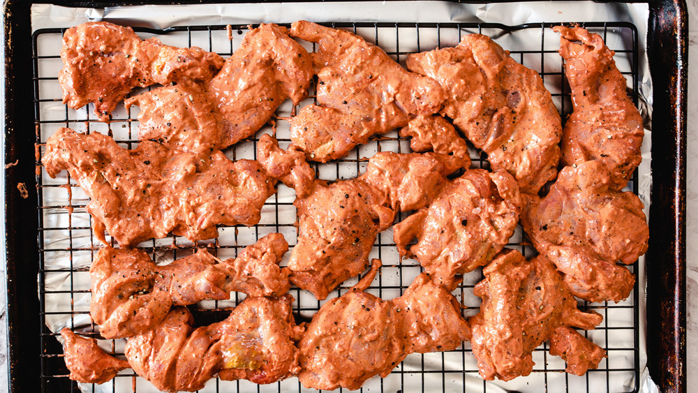 tandoori chicken on baking sheet