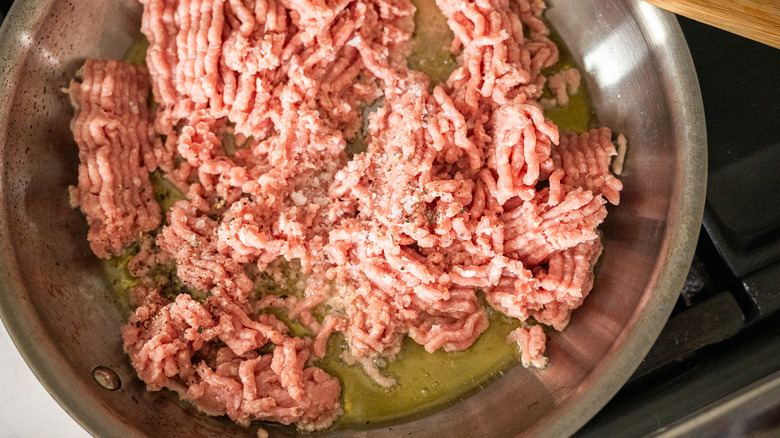 raw ground turkey in skillet