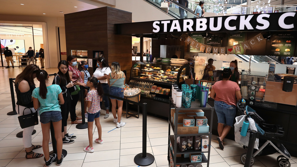 A line of customers at a Starbucks