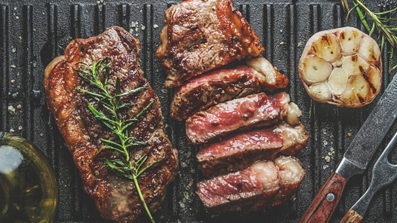 large steak on grill