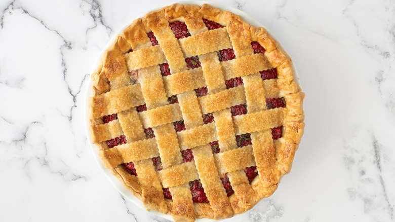 baked golden cranberry pie cooling