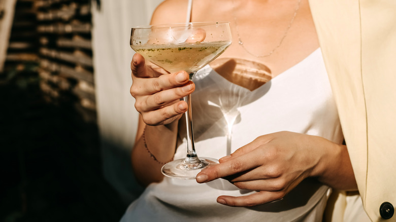 Person holding cocktail