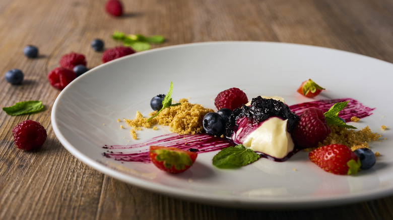 Deconstructed cheescake on a white plate