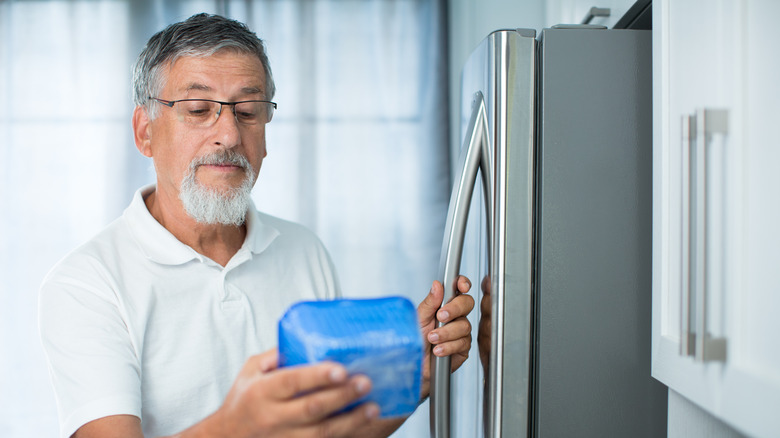 man reviewing expiration date