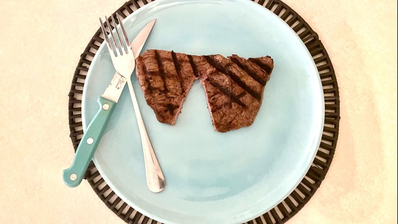 cut sirloin steak with fork