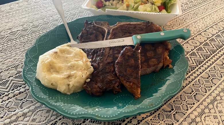 sliced steak with potatoes