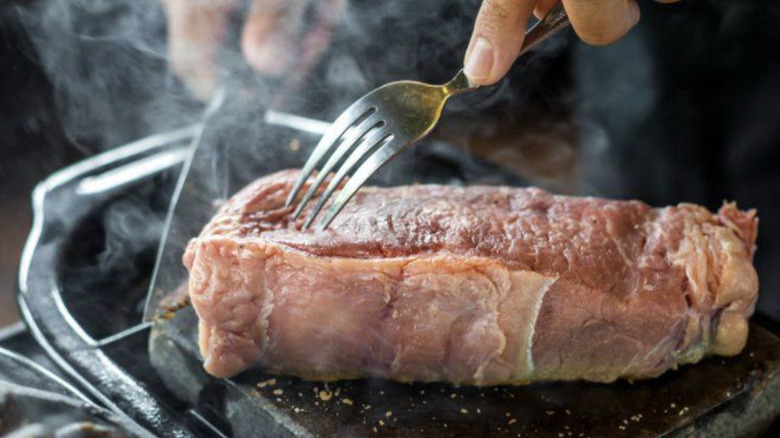 Steak cooked on volcanic rock