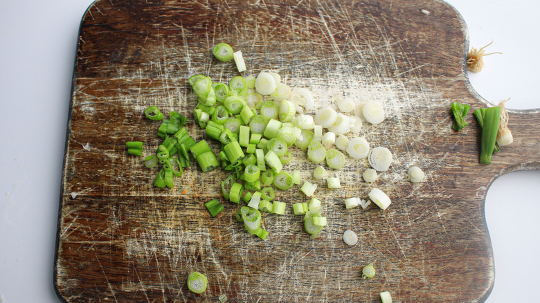 scallions on a cutting board 