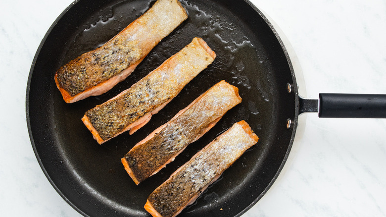 cooking salmon in pan
