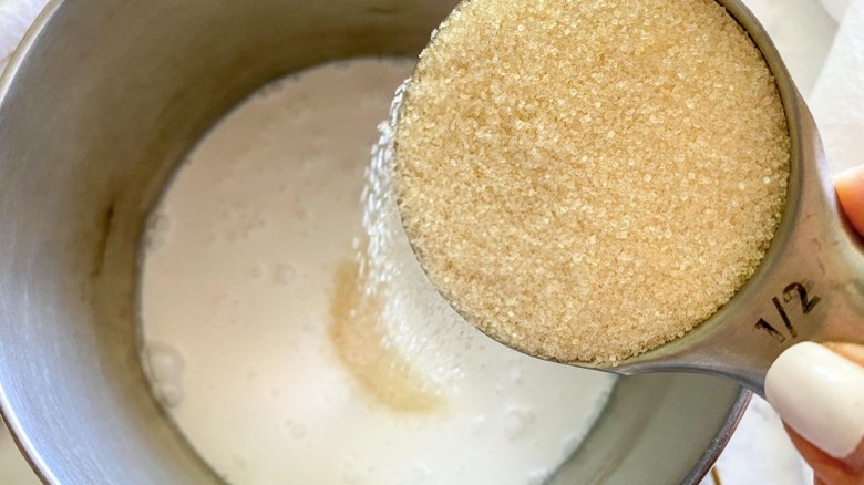 coconut milk with sugar in saucepan
