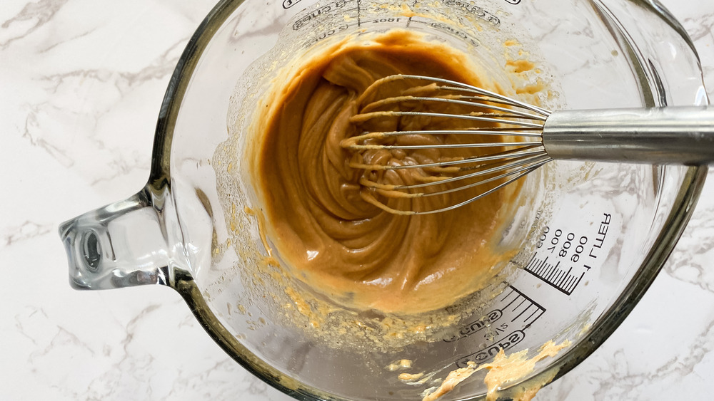 whisking peanut sauce