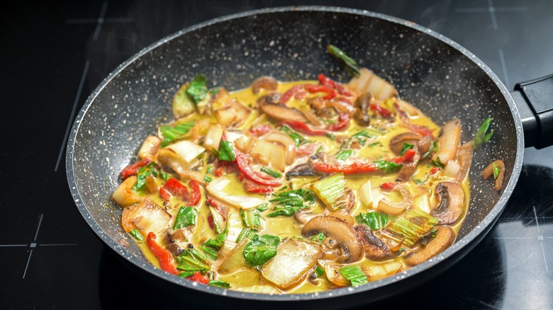 Thai curry cooking on stove