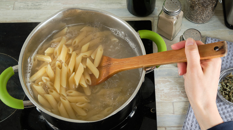 Boiling penne pasta in pot