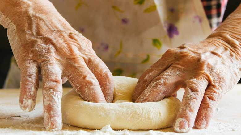 Hands kneading dough