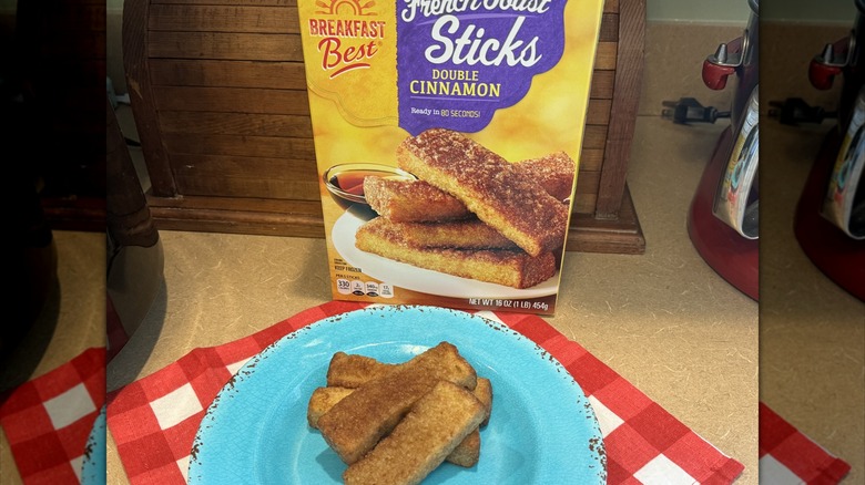 four French toast sticks on a blue plate